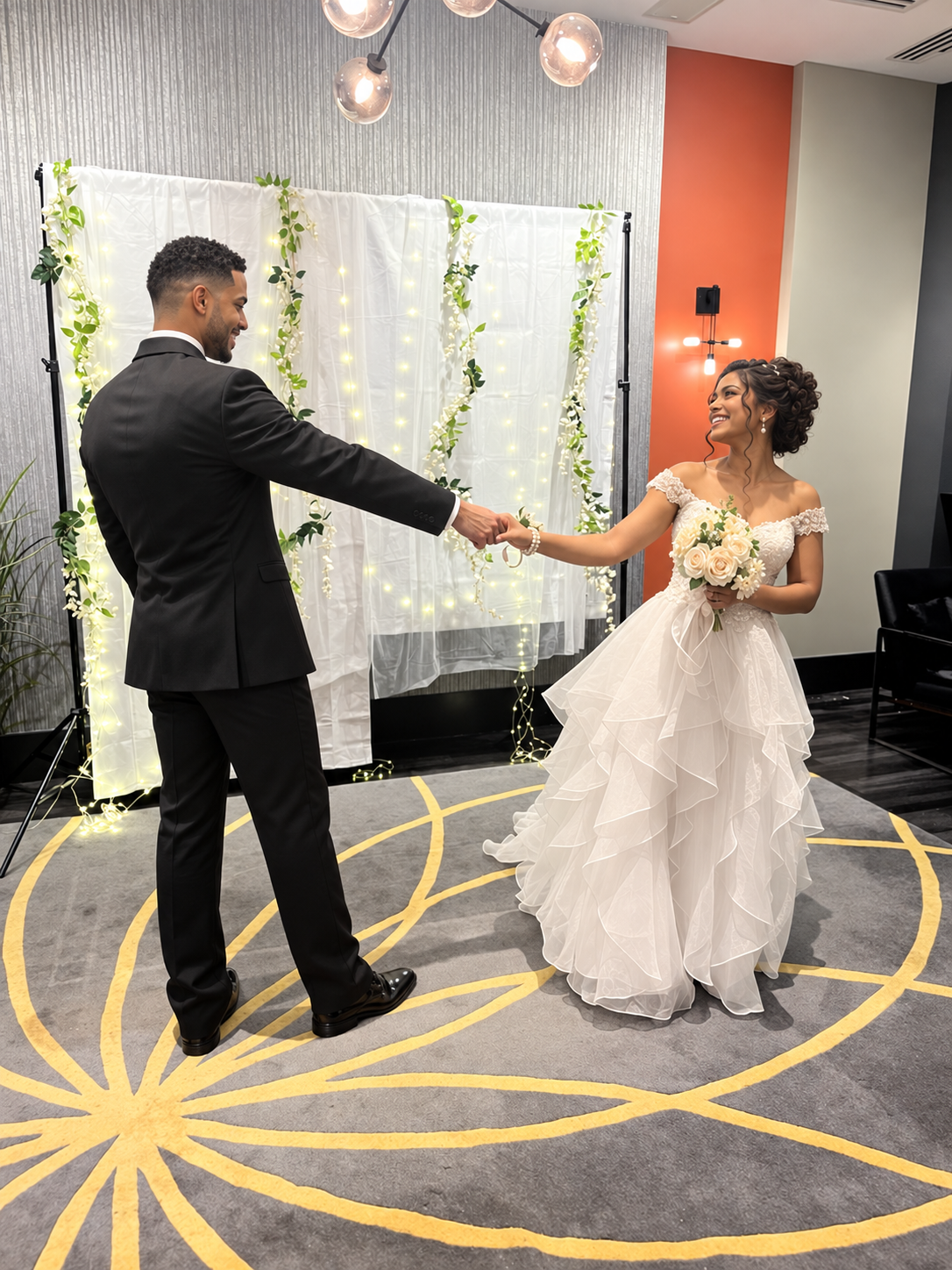 A couple holding hands and laughing during their ceremony
